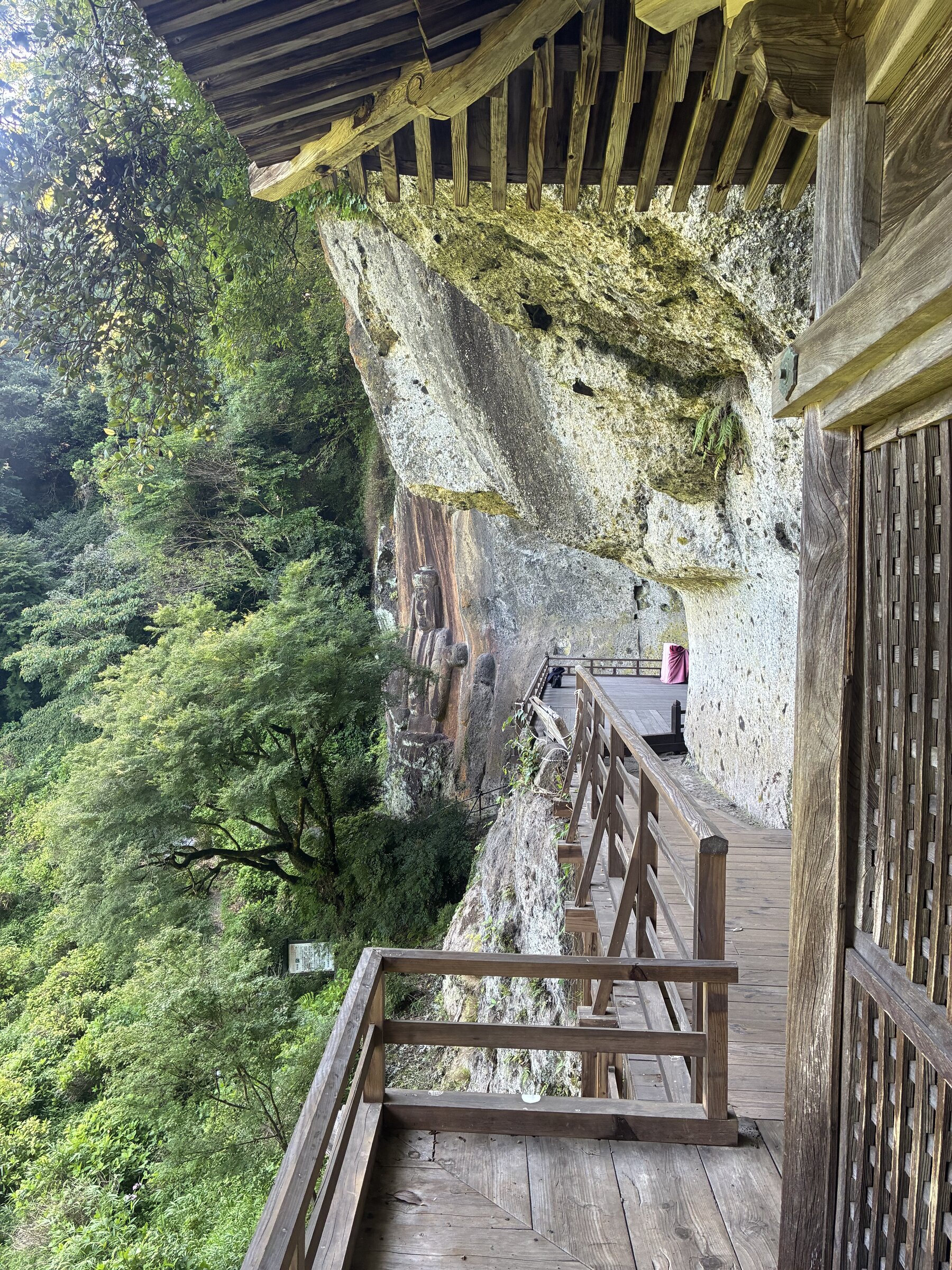 Walking the wooden deck built along the cliff face at Fukoji