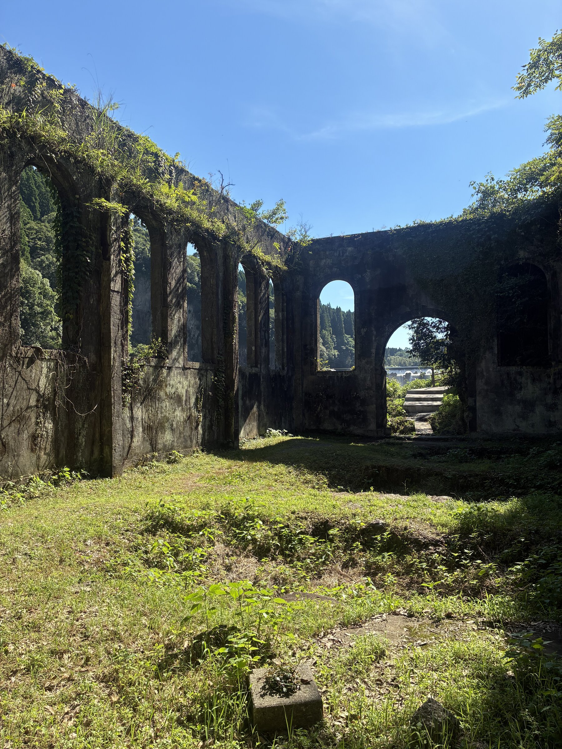 Looking up through the roofless arches of the abandoned Chinda power station